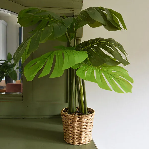 Lifelike Green Leaves in Elegant Beige Wicker Pot