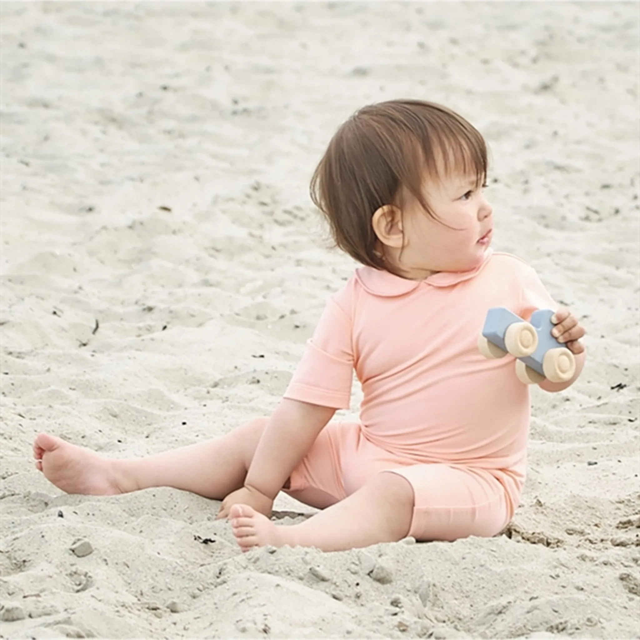 Petit Crabe Rose Nude Palma Onesie with Zipper